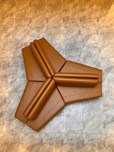 a brown cross made out of chocolate on a tile floor at Uphills boutique hotel in Kallar Vattiyar