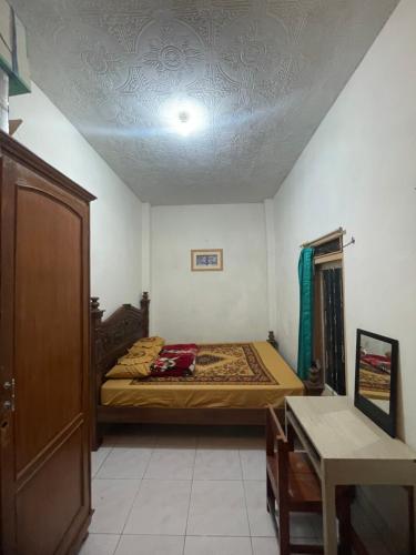 Ένα ή περισσότερα κρεβάτια σε δωμάτιο στο Homestay A2 syariah