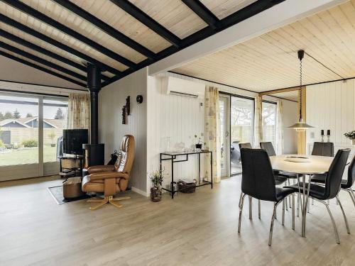 a living room with a table and chairs at 4 star holiday home in Væggerløse-By Traum in Bøtø By