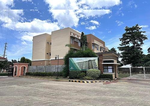 a building with a sign in front of it at Palawan Luxury Stay with Balcony, Free Gym & Pool - B1 5Topaz in Puerto Princesa City