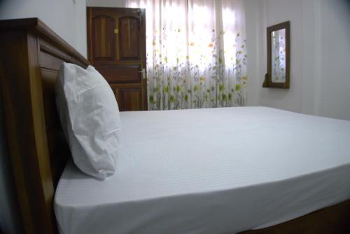 Postel nebo postele na pokoji v ubytování Golden Holiday Home