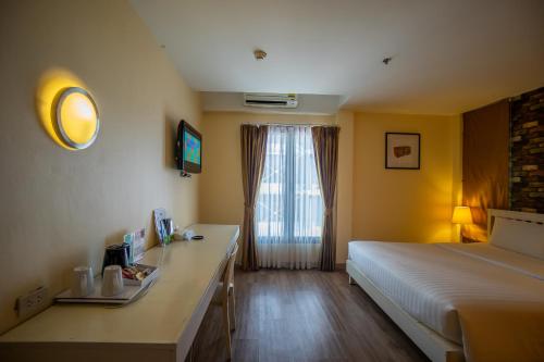 Ein Bett oder Betten in einem Zimmer der Unterkunft ibis Styles Chiang Mai