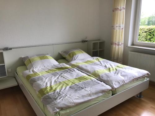 Кровать или кровати в номере Haus am Anker