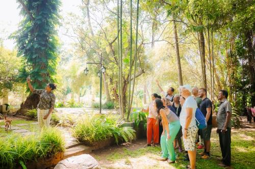 a group of people standing around in a park at Leel’s Safari Cottage in Udawalawe