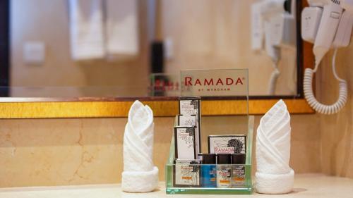 a counter with two white napkinweredweredweredwered at Ramada Hotel Gilgit in Gilgit