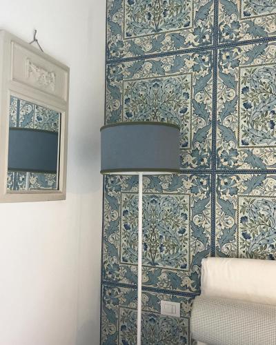 a room with a wall with blue and white tiles at About Italy Holiday Rooms and Apartments in Portovenere