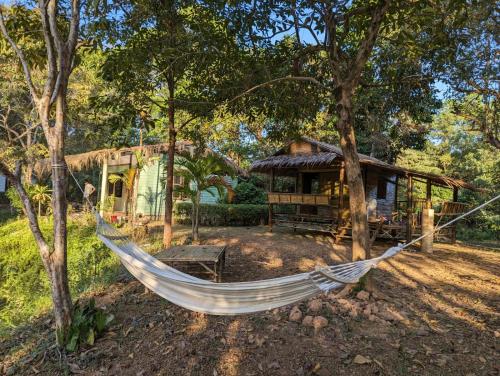 a hammock in front of a house at The River Retreat Koh Mak in Ko Mak