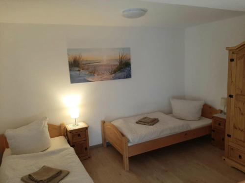 Ένα ή περισσότερα κρεβάτια σε δωμάτιο στο Fiore Gästezimmer Üttingen