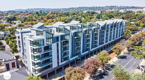 an aerial view of a building with blue windows at OAM The Paramount Houghton in Johannesburg