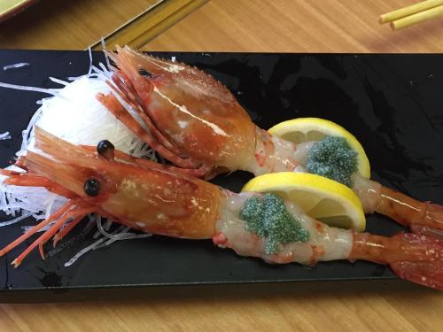 a plate of food with shrimp and rice and vegetables at Kashiwanoha Hotspring Garden Villa&Suite Room in Kashiwa