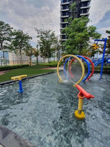 a water park with a water slide at Seaview Infinity Retreat Urban Suite 3R2B 8Pax Georgetown in Jelutong