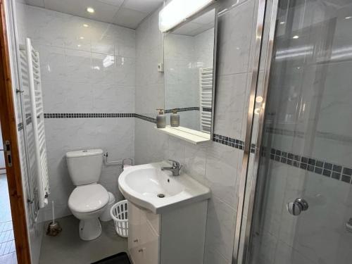 a bathroom with a toilet and a sink and a shower at Golden Tours - Studio moderne in Tours