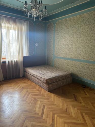 a room with a bed in the corner of a room at гостевой дом in Sevan