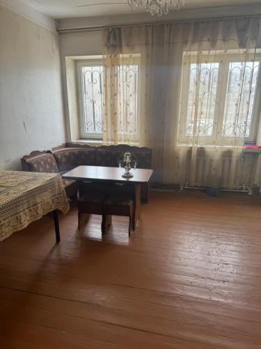 a living room with a couch and a table at гостевой дом in Sevan