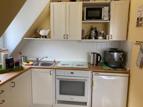 Kuchyň nebo kuchyňský kout v ubytování Terrassenwohnung