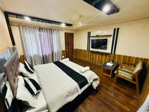 Postel nebo postele na pokoji v ubytování Hotel Luxury Inn