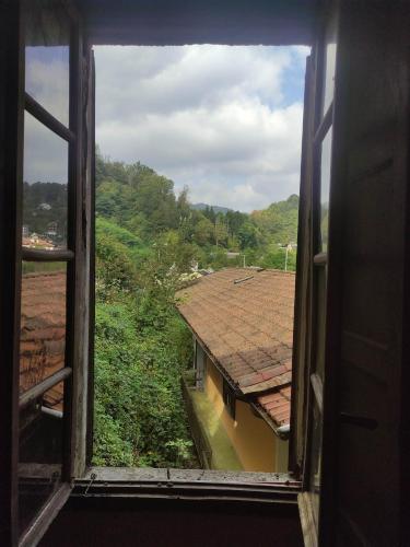 a window view of a house with a roof at Casa Valduggia in Valduggia
