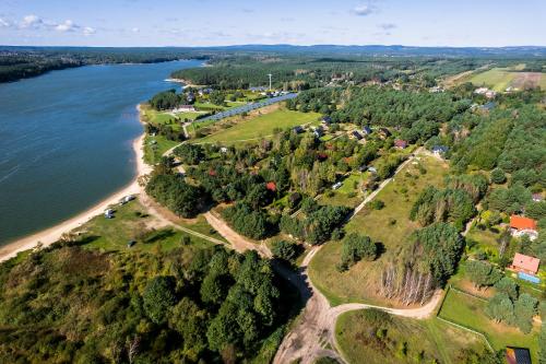 an aerial view of a river and a village at Domek w brzozach in Chańcza