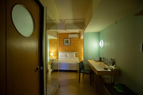 Ein Bett oder Betten in einem Zimmer der Unterkunft ibis Styles Chiang Mai