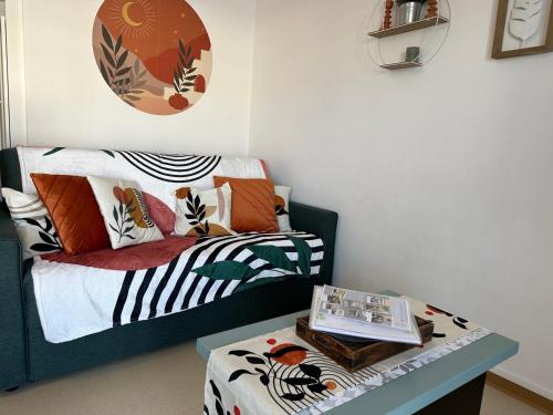 Ένα ή περισσότερα κρεβάτια σε δωμάτιο στο Studio cabine vue mer latérale