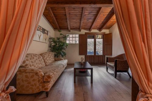 a living room with a couch and a table at Hotel - Restaurante Prado Del Navazo in Albarracín
