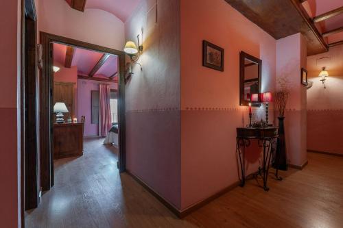 a hallway with an open door to a room at Hotel - Restaurante Prado Del Navazo in Albarracín