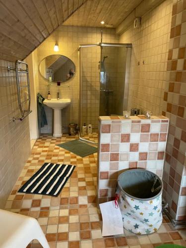 a bathroom with a shower and a sink and a tub at House built in 1901 close to Eurovision in Limhamn