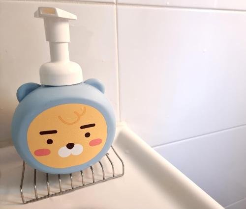 a blue soap dispenser with a hello kitty face at Y202 & B201 near Hongdae Univ Station in Seoul