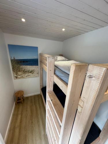 a room with two bunk beds in a house at Ferienhaus Lillehus in Fehmarn