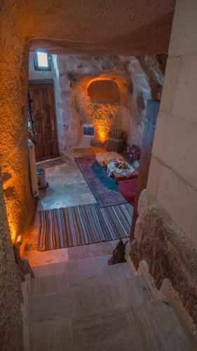 an overhead view of a room with a bed in a cave at Theodora Village House in Urgup
