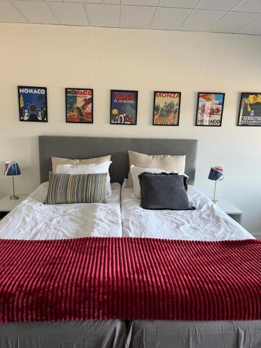a bedroom with two beds and posters on the wall at Route 154, 15 min till Ullared in Älvsered