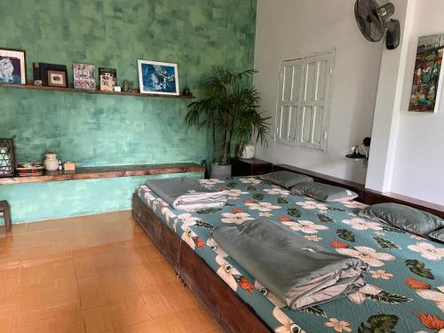 a bedroom with a bed in a room at Cọ cùn homestay/ Handmade/ Artwork (2 beds) in Buon Ma Thuot