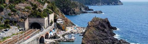 a tunnel on a mountain next to the ocean at Cinqueterre National Park Sea view in Framura