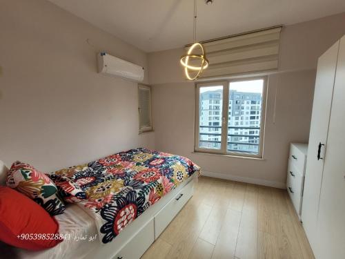 a bedroom with a bed and a window at Bursa star in Bursa