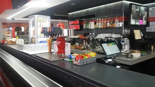 a counter in a coffee shop with a laptop on it at Motel Pávov in Jihlava