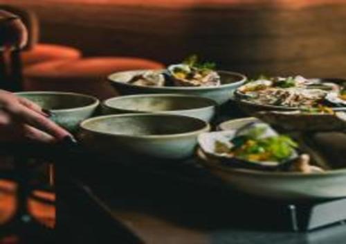 a group of bowls of food on a table at Nonam Boutique Hotel Gent in Ghent