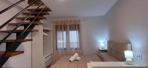 Postel nebo postele na pokoji v ubytování Casa Cazorla c del valle II