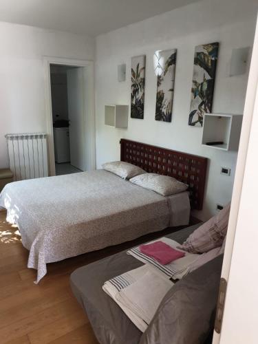 a bedroom with two beds in a room at Residence natura beach in Lido di Volano