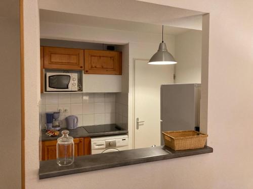 Køkken eller tekøkken på Bel appartement en duplex