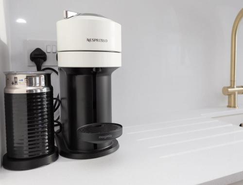a coffee maker sitting on a kitchen counter at Luxury 1 Bed Apartment Covent Garden Holborn in London