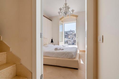 a bedroom with a bed and a window at Terrazze San Martino in Matera