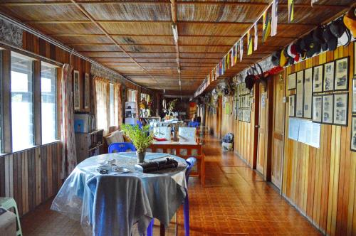 a dining room with a table in a train at Labang Guesthouse Bario in Bario