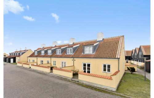 a row of houses on the side of a street at Gorgeous Apartment In Skagen With Sauna in Skagen