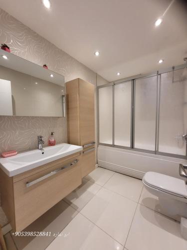 a bathroom with a sink and a toilet at Apartment Resort Bursa in Bursa