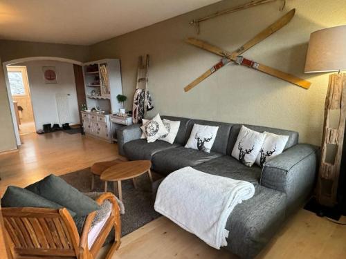 a living room with a couch and a table at Appartement 4.5 pièces Crans-Montana in Lens