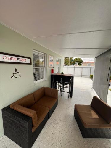 a living room with a couch and a table at Casita Cafe in Miami