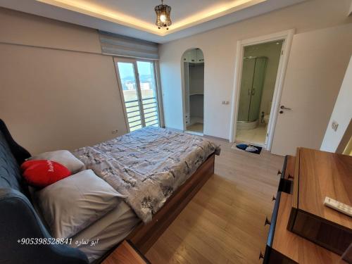 a bedroom with a bed in a room at تركيا . بورصا . منتجع بورصا مودرن in Bursa