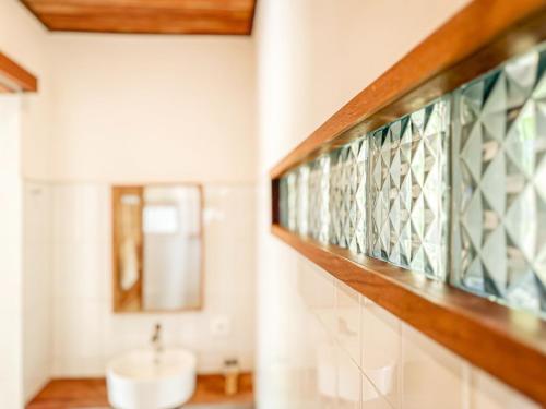 a bathroom with a sink and a mirror at Private Pool Villa Retreat NAMU no4 no5 no6 in Kuta Lombok