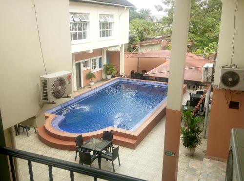 a swimming pool in the middle of a building at Petesville Hotel Limited in Calabar