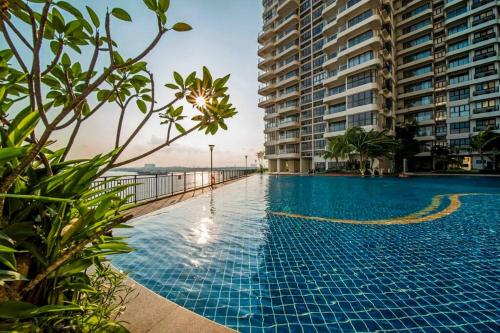 a swimming pool in the middle of a building at Modern Studio 4 pax Danga Bay Shopping Mall in Johor Bahru